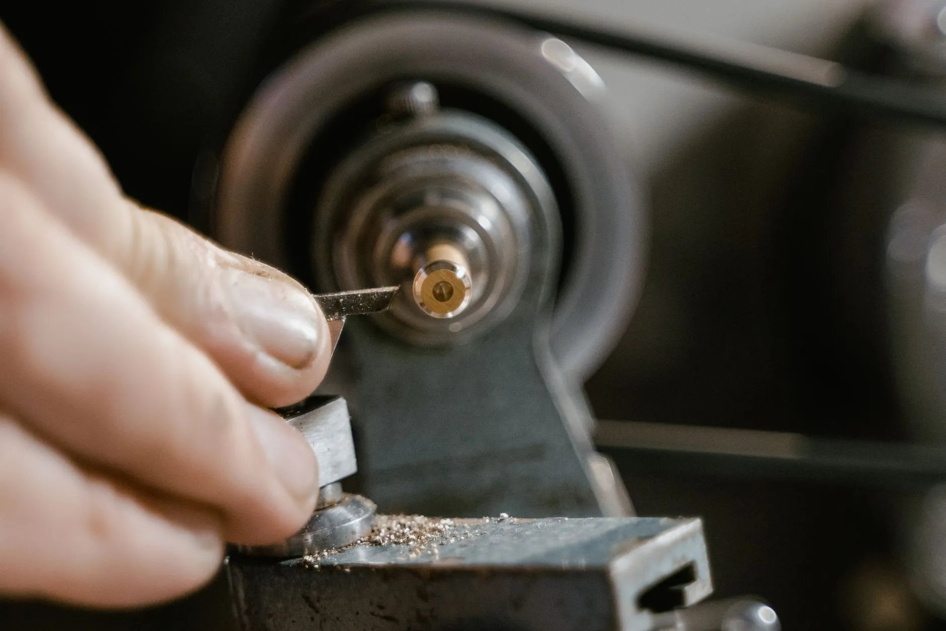 Case parts are cut from bar stock and finished on a watchmaker’s lathe, one at a time.
